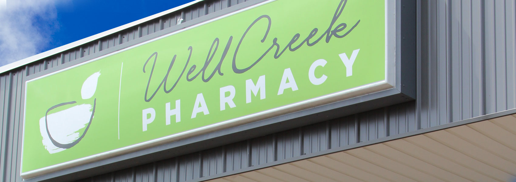 well creek pharmacy signage